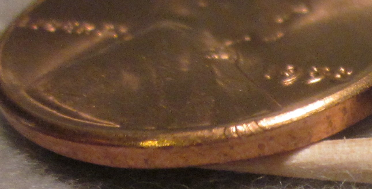 1958-Wheat-Penny-With-Part-Of-Lettering-Stamped-On-Rim/Edge?